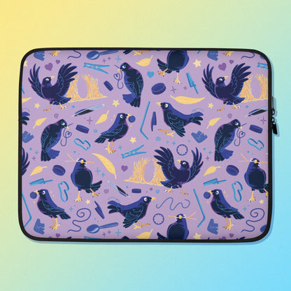 Laptop sleeve with a colourful purple, blue and yellow satin bowerbird pattern on a yellow and blue gradient background.