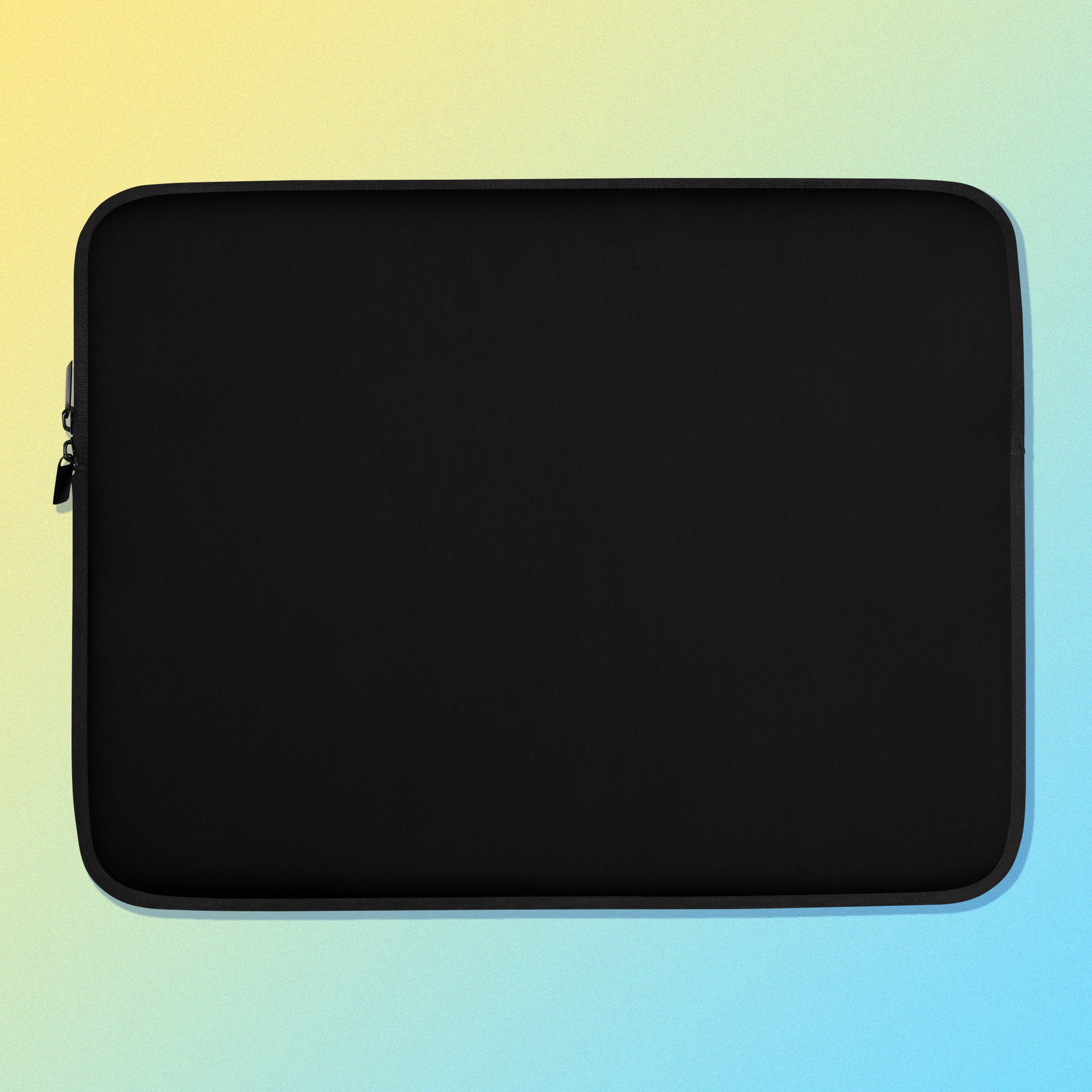 Laptop sleeve with a plain black colour on one side and a colourful purple, blue and yellow satin bowerbird pattern on the other on a yellow and blue gradient background.