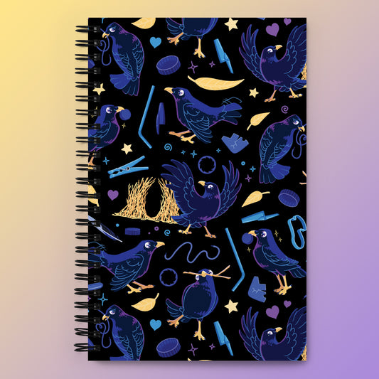 Spiral notebook with a colourful purple, blue and yellow satin bowerbird pattern on a yellow and purple gradient background.