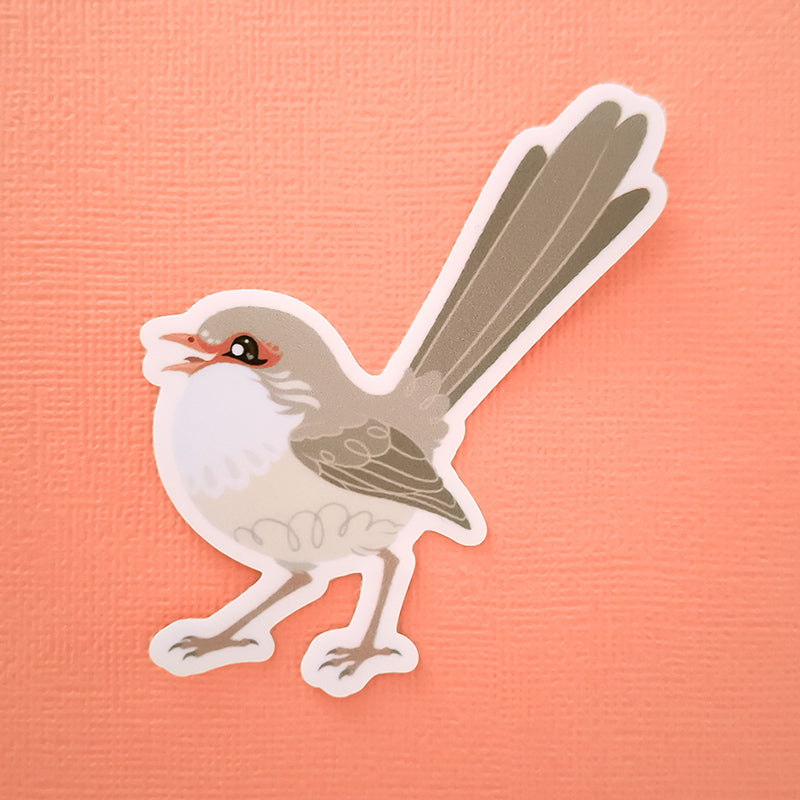 Real photo of a colourful sticker of a female Red-backed Fairywren chirping on a peach canvas textured background.