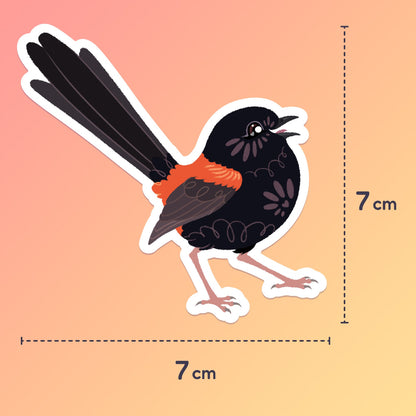 7x7cm colourful sticker of a male Red-backed Fairywren chirping on a red. orange and yellow gradient background.