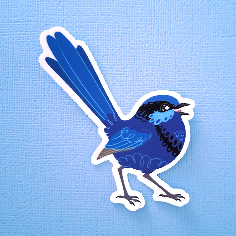 Real photo of a colourful sticker of a male Splendid Fairywren chirping on a blue canvas textured background.