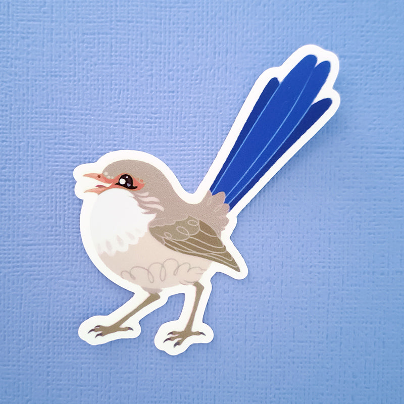 Real photo of a colourful sticker of a female White-winged Fairywren chirping on a blue canvas textured background.