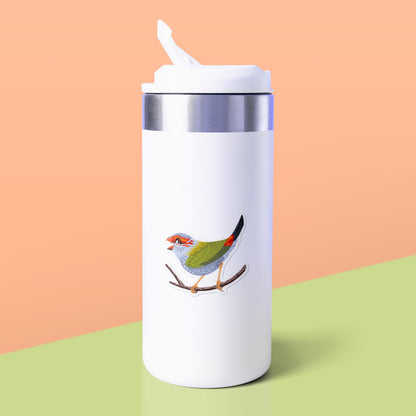Colourful sticker of a red-browed firetail finch stuck to a white metal drink bottle on a soft green table on an orange background.