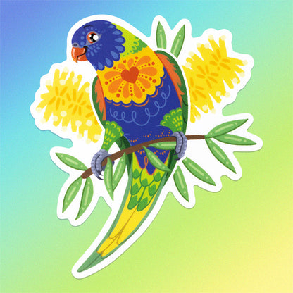 Colourful sticker of a rainbow lorikeet with yellow bottlebrush flowers on a blue, green and yellow gradient background.