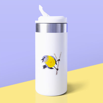 Colourful sticker of an eastern yellow robin perched on a lichen-covered branch stuck to a white metal drink bottle on a yellow table on a lilac background.