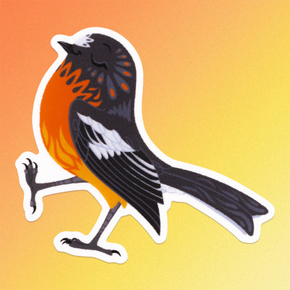 Colourful sticker of a male flame robin walking with pep in his step on an orange and yellow gradient background.