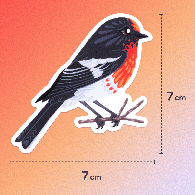 7x7cm colourful sticker of a male red-capped robin perched on a lichen-covered branch on a red, orange and white gradient background.