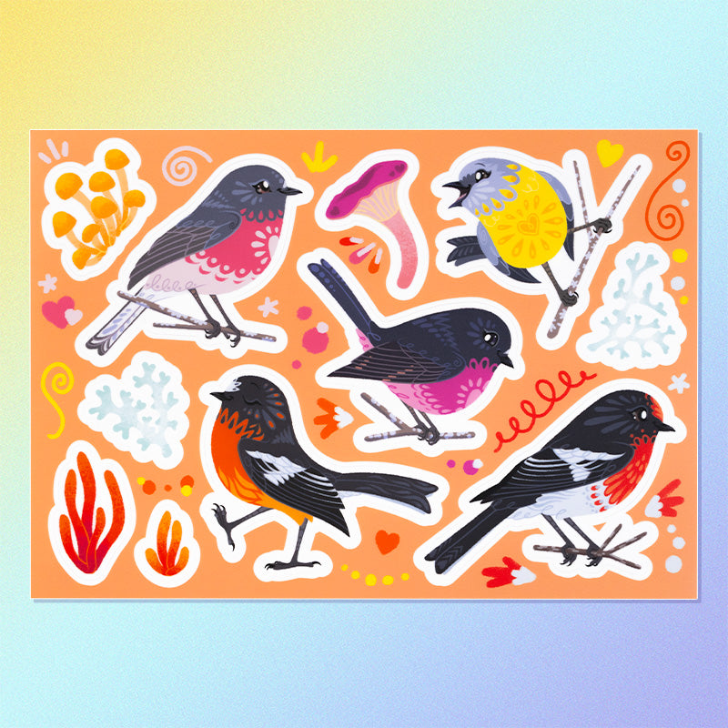 11 colourful red/pink/orange/black Australian robin, lichen and fungi stickers on a sheet on a yellow, blue and purple gradient background.