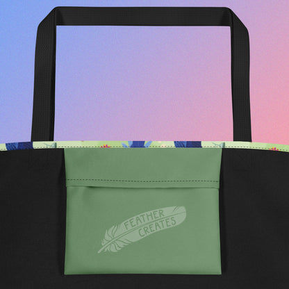 Close up of a green fold-over pocket on the inside of a tote bag with a black strap on a gradient blue and purple background.