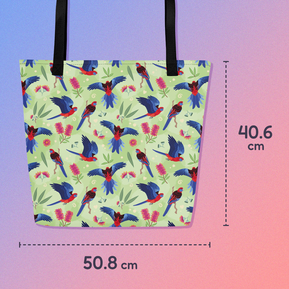 40.6 x  50.8 tote bag with black handles and a crimson rosella parrot pattern on a gradient purple and pink background