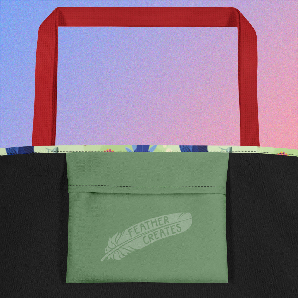 Close up of a green fold-over pocket on the inside of a tote bag with a red strap on a gradient blue and purple background.