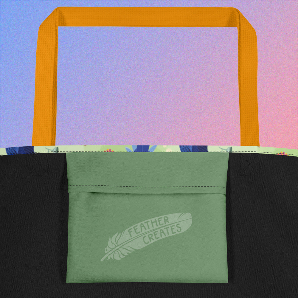 Close up of a green fold-over pocket on the inside of a tote bag with a yellow strap on a gradient blue and purple background.