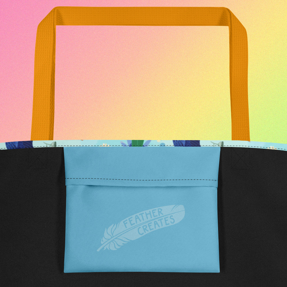 Close up of a blue fold-over pocket on the inside of a tote bag with a yellow strap on a gradient pink, yellow and green background.