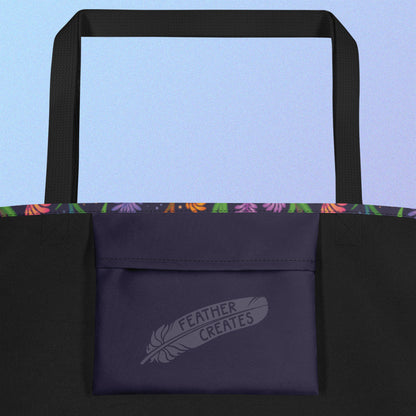 Close up of a dark purple fold-over pocket on the inside of a tote bag with a black strap on a gradient blue and purple background.