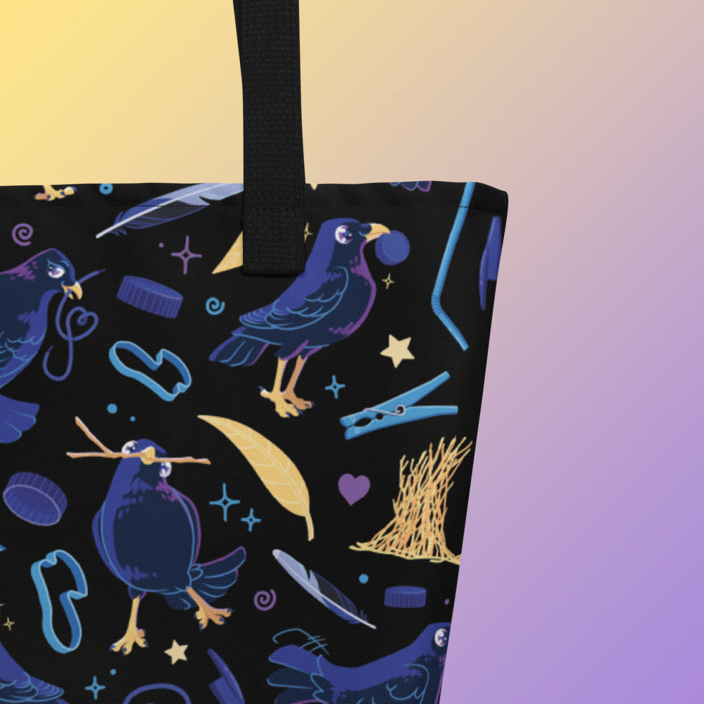 Close up of a tote bag with black handles and a black/blue/yellow satin bowerbird pattern pattern on a yellow and purple gradient background.