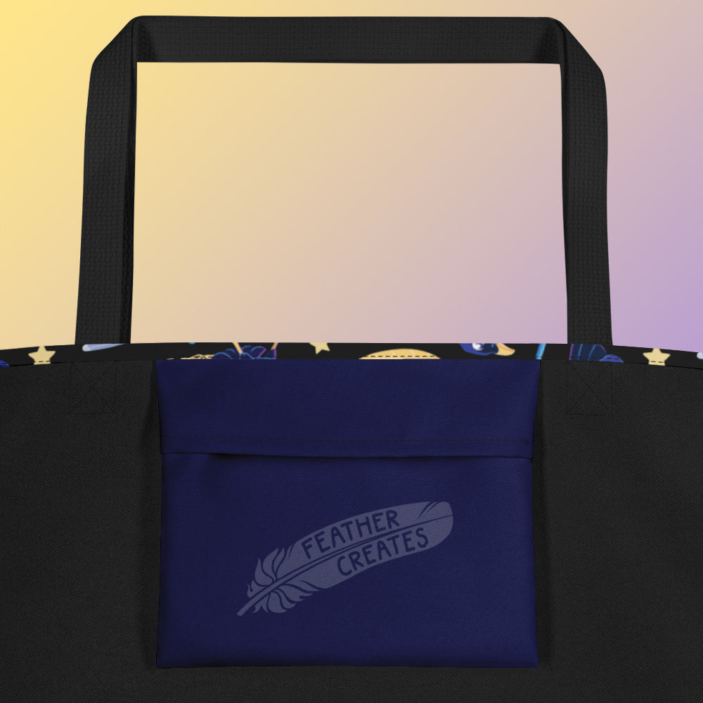 Close up of a dark blue fold-over pocket on the inside of a tote bag with a black strap on a gradient yellow and purple background.