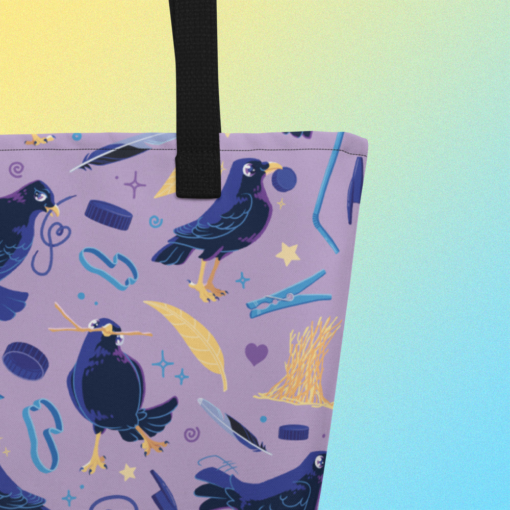 Close up of a tote bag with black handles and a purple/blue/yellow satin bowerbird pattern on a yellow and blue gradient background.