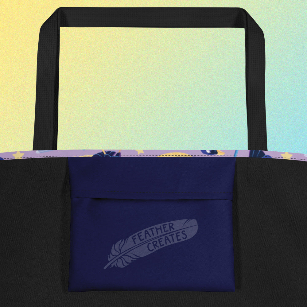 Close up of a dark blue fold-over pocket on the inside of a tote bag with a black strap on a gradient blue and yellow background.