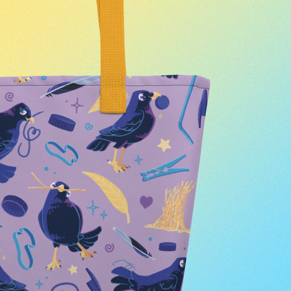 Close up of a tote bag with yellow handles and a purple/blue/yellow satin bowerbird pattern on a yellow and blue gradient background.