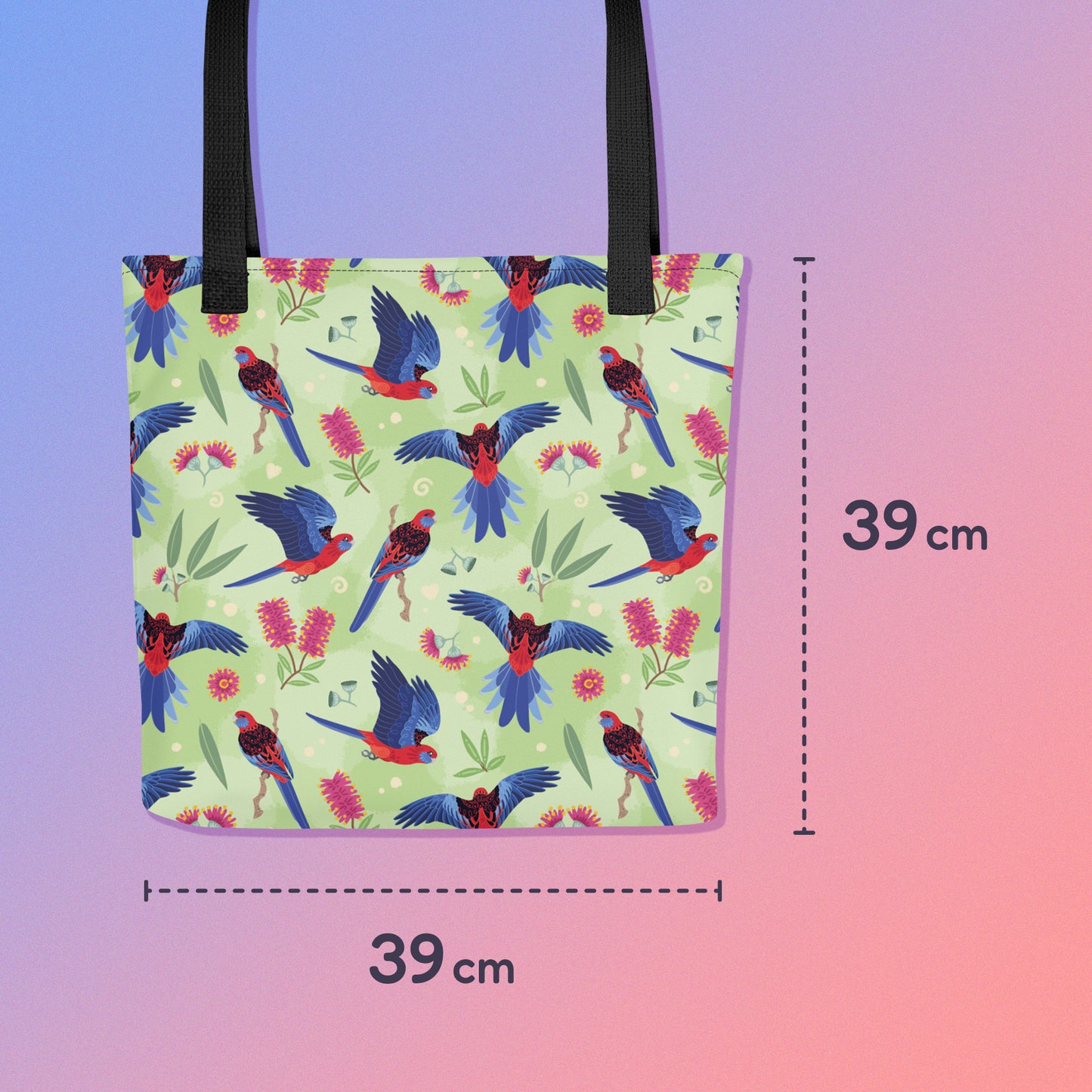 39 x 39cm tote bag with black handles and a crimson rosella parrot pattern on a gradient purple and pink background