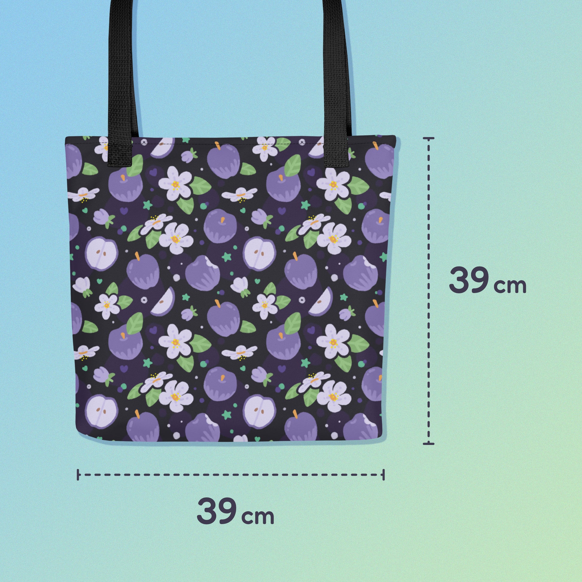39 x 39cm tote bag with a black strap and purple apple and flower pattern on a gradient blue and green background