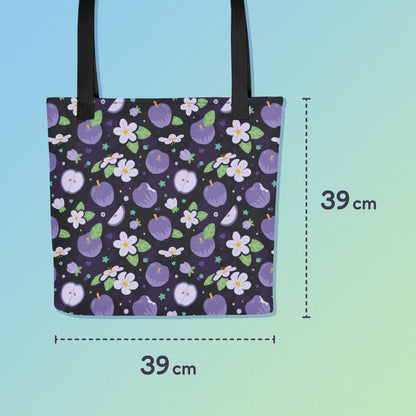 39 x 39cm tote bag with a black strap and purple apple and flower pattern on a gradient blue and green background