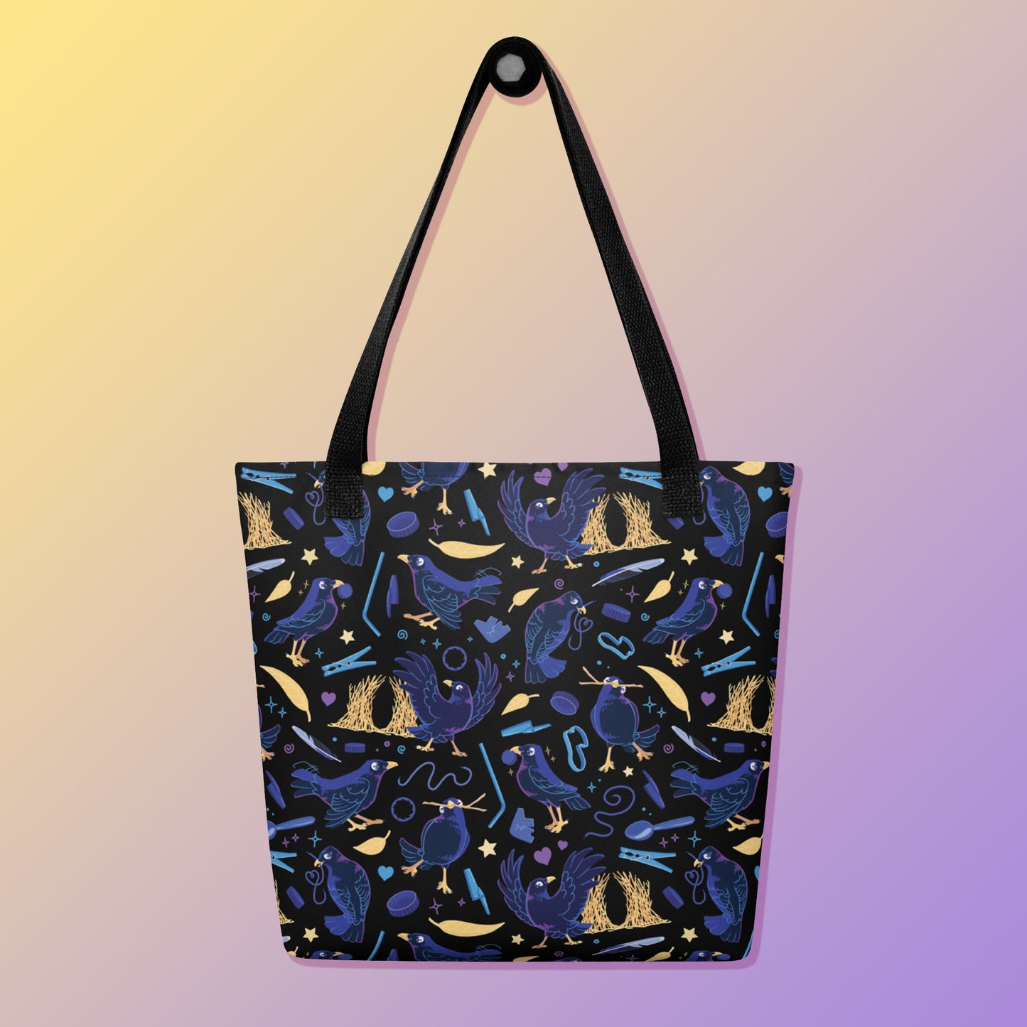 Tote bag with black handles and a black/blue/yellow satin bowerbird pattern pattern on a yellow and purple gradient background